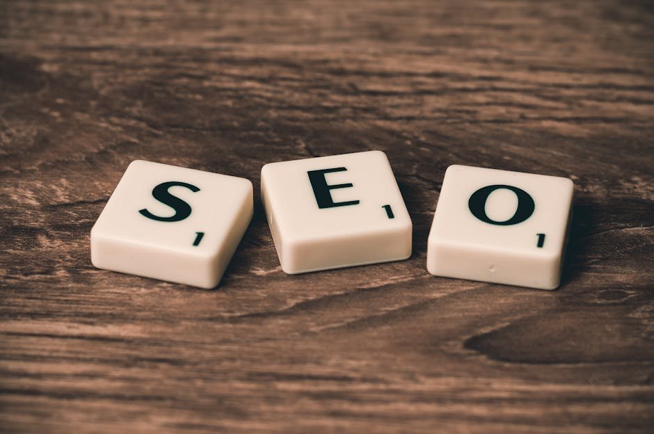 Scrabble tiles spelling SEO on a wooden surface.